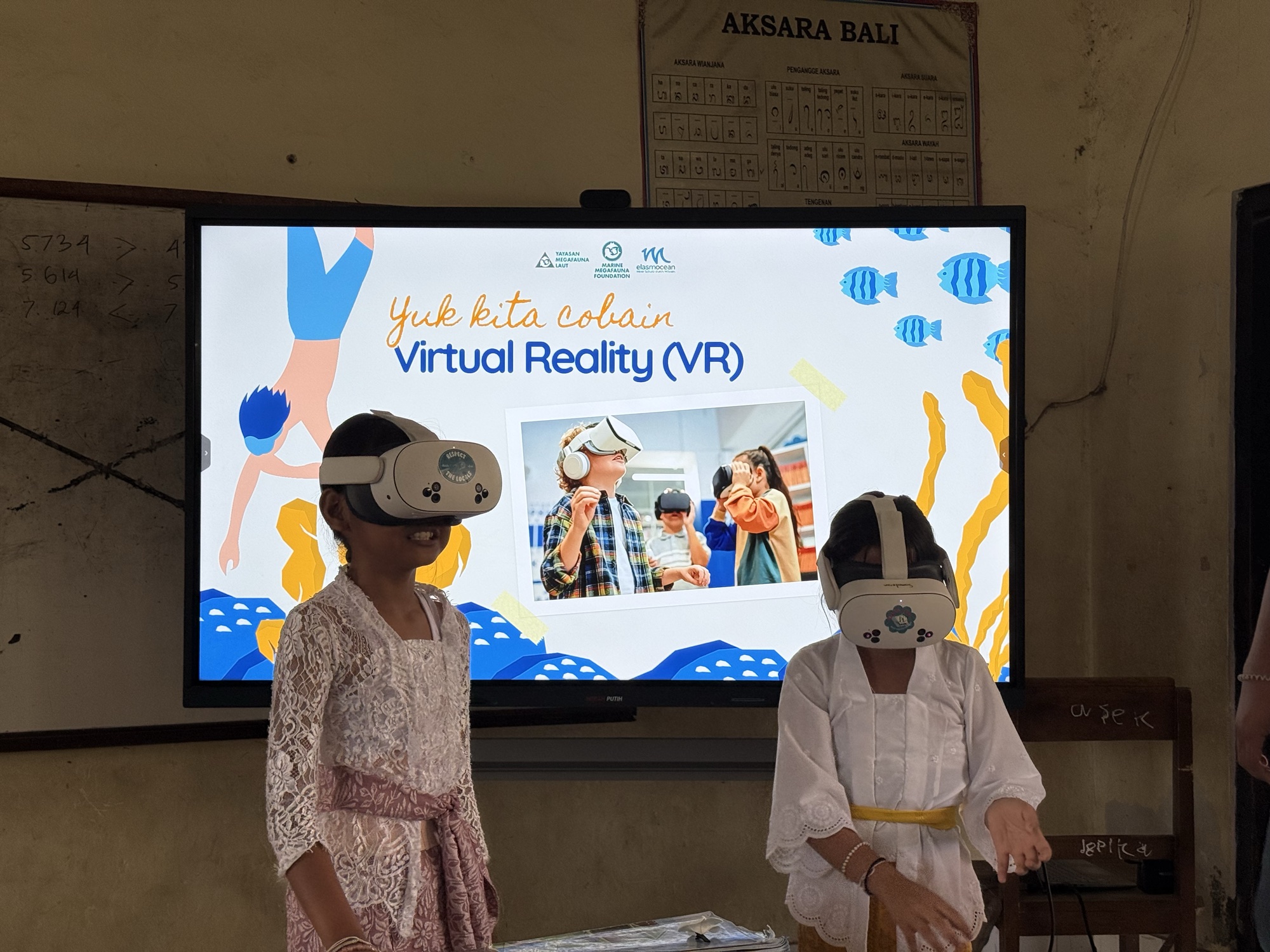 Students in Bali explore the ocean through virtual reality headsets during a 2026 school visit