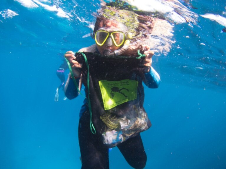 Collecting some trash while we’re in the water!
