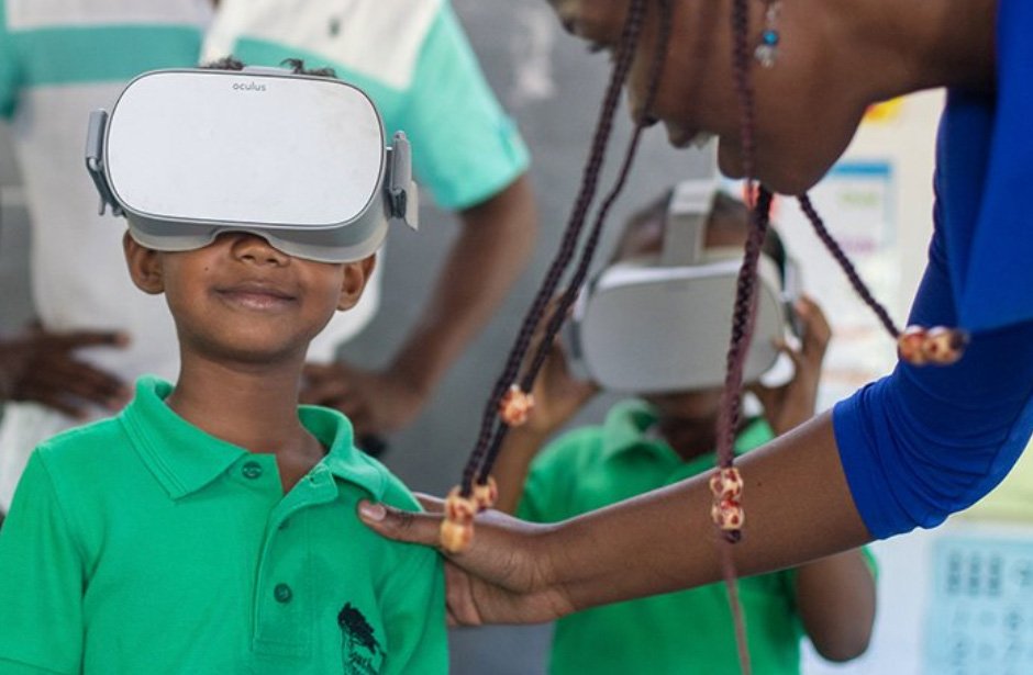 A child watches an underwater film through a virtual reality headset
