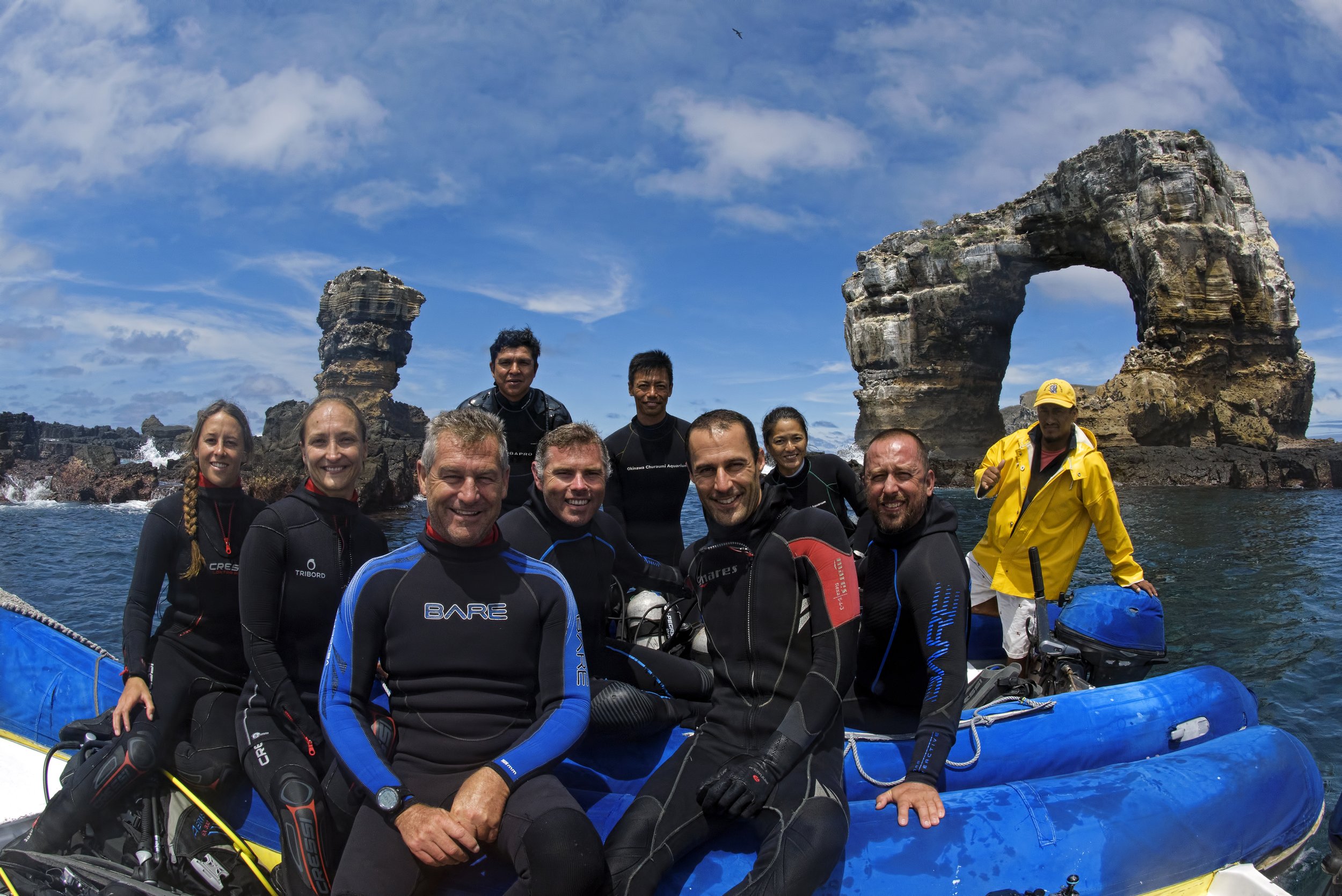 The research team in an inflatable boat in front of Darwin's Arch