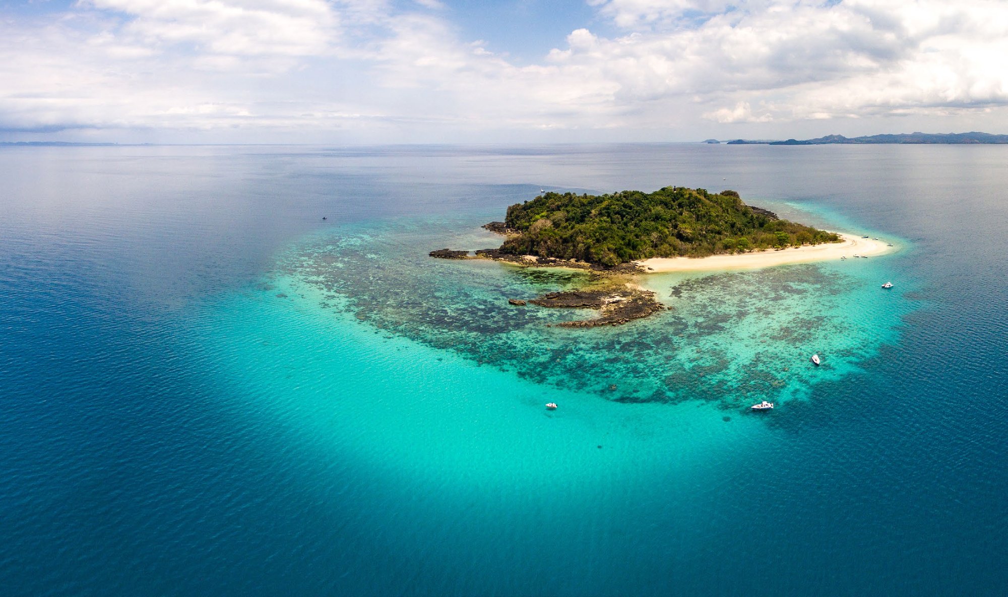 Aerial view of Nosy Tanikely, with Nosy Be in background